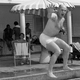 The original Associated Press caption for this photo: “Y.A. Tittle, quarterback for the New York Football Giants who is best known for his passing, carries the ball as he jumps into pool during the ball as he jumps into pool during vacation at San Juan, Puerto Rico on May 8, 1964. Tittle is one of a contingent of Giants visiting Puerto Rico to teach football to the natives.”